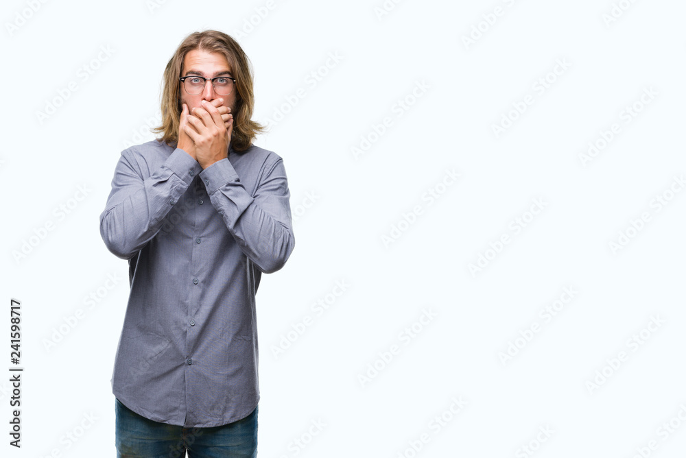 Young handsome man with long hair wearing bow tie over isolated background shocked covering mouth with hands for mistake. Secret concept. Young handsome man with long hair wearing bow tie over isolated background shocked covering mouth with hands for mistake. Secret concept.