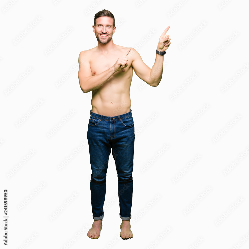 Handsome shirtless man showing nude chest smiling and looking at the camera pointing with two hands and fingers to the side. Handsome shirtless man showing nude chest smiling and looking at the camera pointing with two hands and fingers to the side.