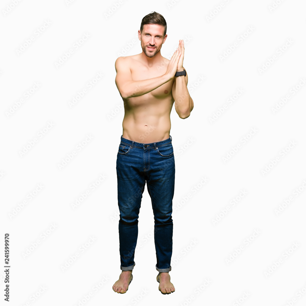 Handsome shirtless man showing nude chest Clapping and applauding happy and joyful, smiling proud hands together