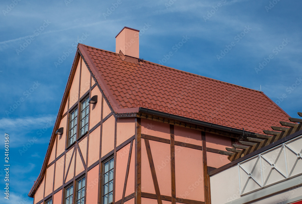 A view of typical vintage house with tile roof