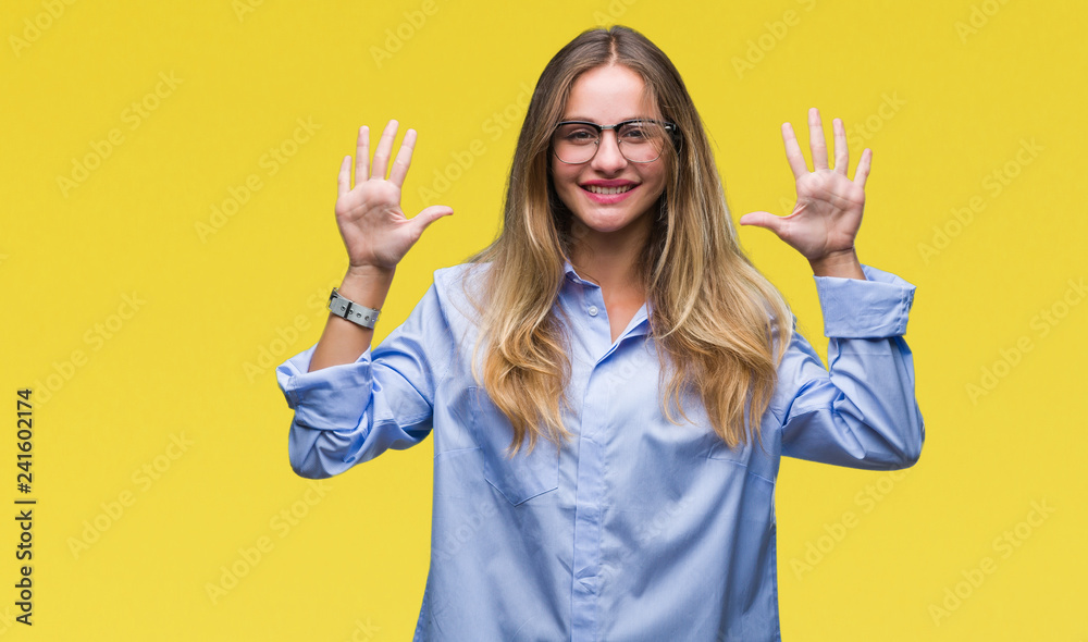 Young beautiful blonde business woman wearing glasses over isolated background showing and pointing up with fingers number ten while smiling confident and happy.