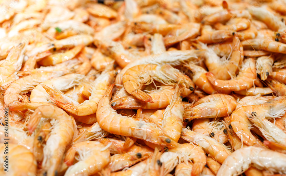 Shrimps. Fresh Prawns close-up. Seafood rotated on crashed ice, food background, top view, preparing healthy food, cooking, diet, nutrition concept. Shrimps. Fresh Prawns close-up. Seafood rotated on crashed ice, food background, top view, preparing healthy food, cooking, diet, nutrition concept.