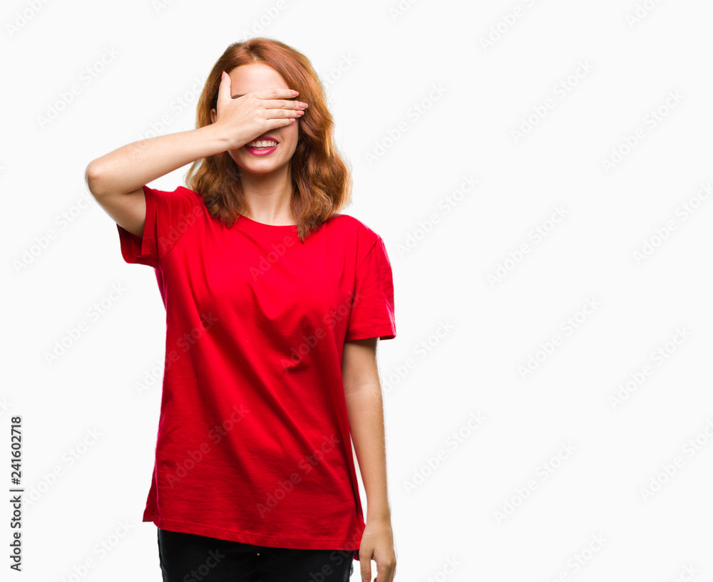 Young beautiful woman over isolated background smiling and laughing with hand on face covering eyes for surprise. Blind concept. Young beautiful woman over isolated background smiling and laughing with hand on face covering eyes for surprise. Blind concept.