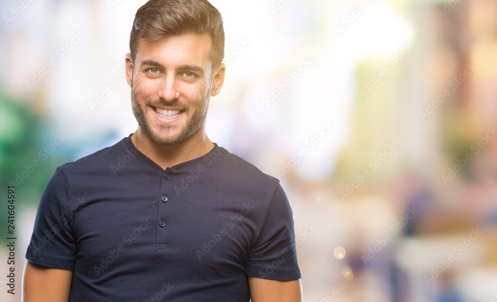 Young handsome man over isolated background looking away to side with smile on face, natural expression. Laughing confident. Young handsome man over isolated background looking away to side with smile on face, natural expression. Laughing confident.