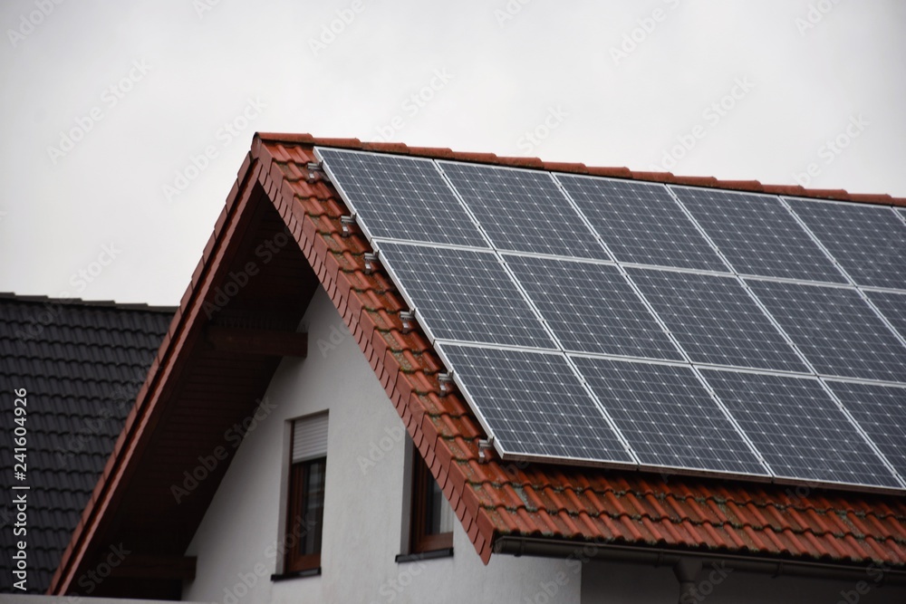 solar panels on the tiled roof of a residential building