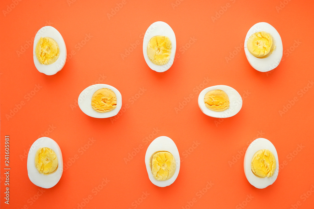 Fototapeta Pattern of boiled eggs on an orange background. Easter template, top view