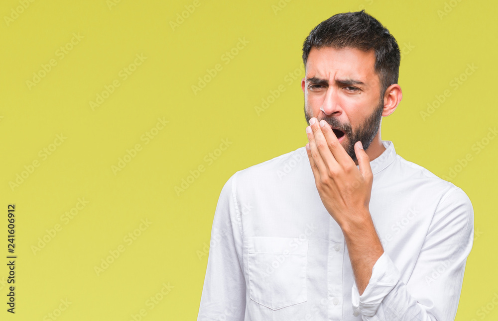 Adult hispanic man over isolated background bored yawning tired covering mouth with hand. Restless and sleepiness. Adult hispanic man over isolated background bored yawning tired covering mouth with hand. Restless and sleepiness.