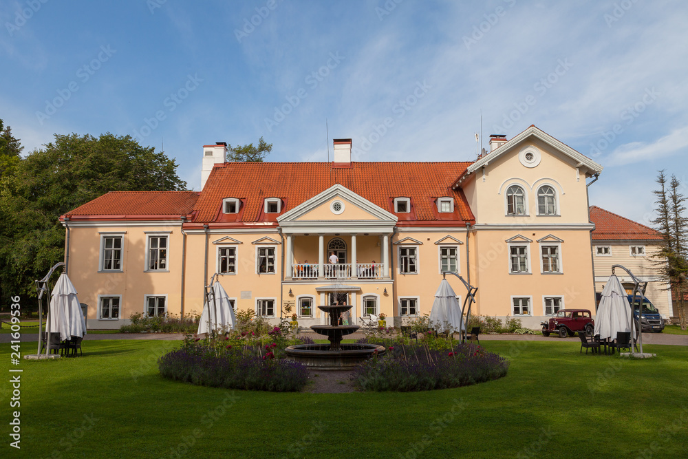 An old manor Vihula in Estonia, Lahemaa park. Beautiful summer landscape with pond