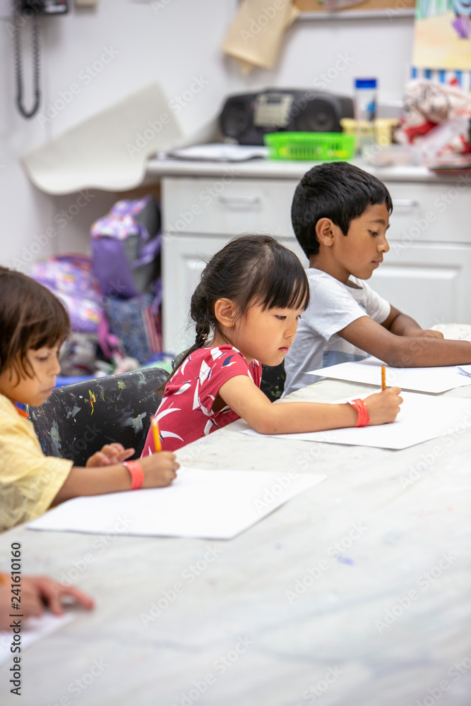Fototapeta premium Young children drawing