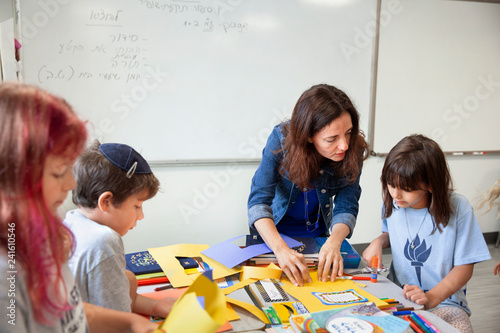 Canvas Print Teacher helping young girl
