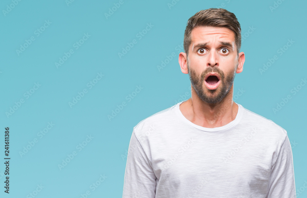 Young handsome man over isolated background afraid and shocked with surprise expression, fear and excited face. Young handsome man over isolated background afraid and shocked with surprise expression, fear and excited face.