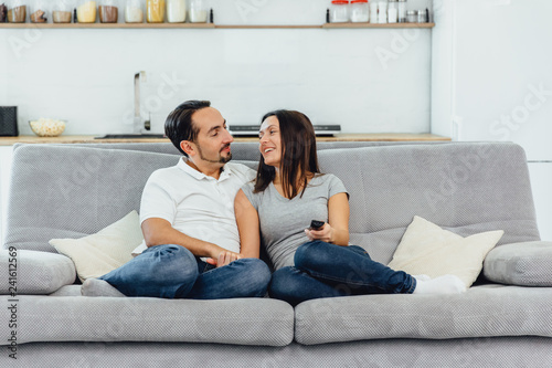 Husband and wife sitting on a sofa