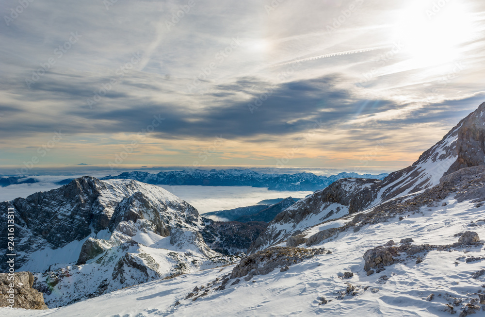 Spectacular winter mountain panorama with peaks covered with early snow.