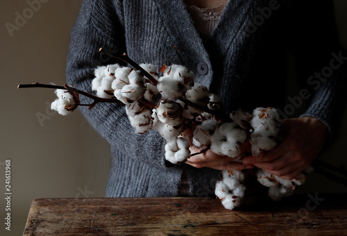Woman with cotton twigs photo