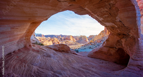Arch Canyon window to the Valley with the bluesky and colorful sandstone reflection with sunray photo