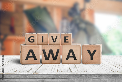 Give away contest sign on a wooden desk