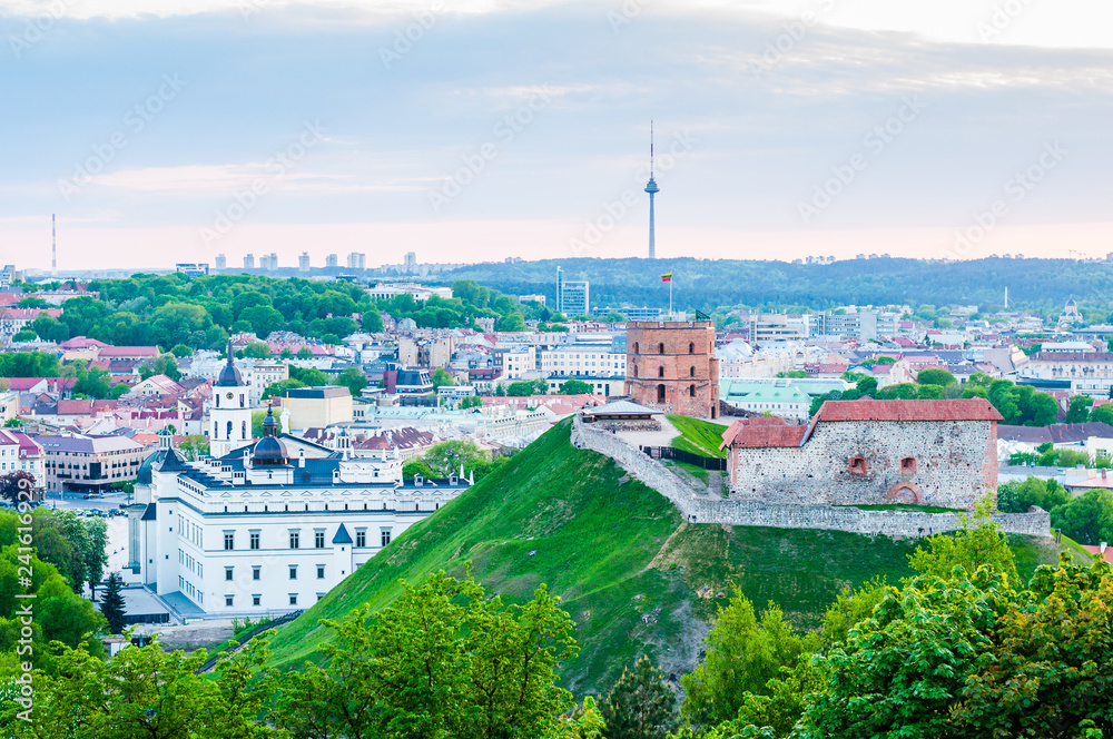 Cityscape skyline view on famous Gediminas castle complex and tv tower on the background from Three Crosses Hill panoramic viewpoint