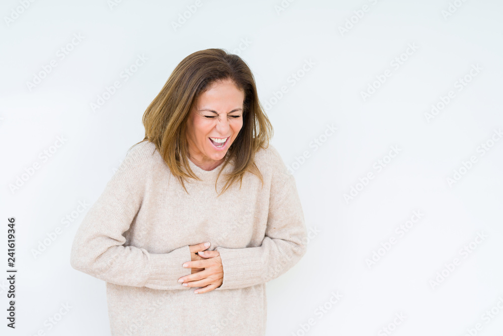 Beautiful middle age woman over isolated background with hand on stomach because indigestion, painful illness feeling unwell. Ache concept. Beautiful middle age woman over isolated background with hand on stomach because indigestion, painful illness feeling unwell. Ache concept.