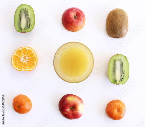 Fototapeta Naklejka Na Ścianę i Meble -  Top view of juice in glass and fruits isolated on white background. Food and healthy concept.
