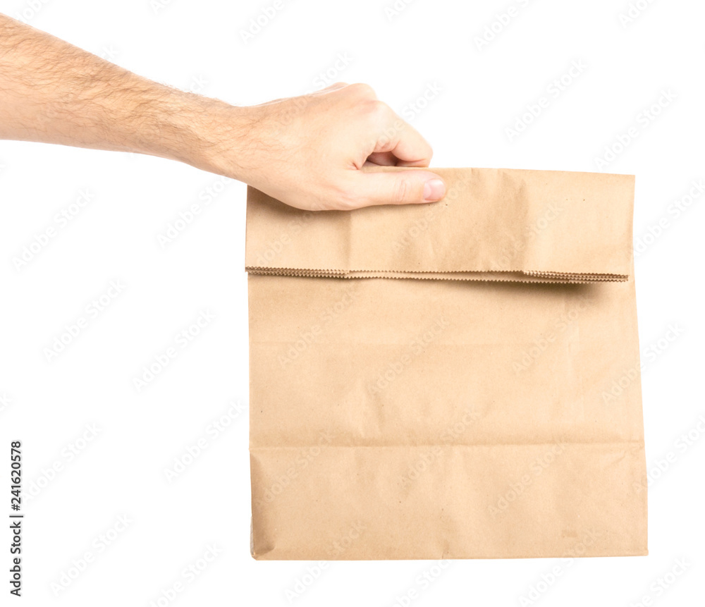 Package bag delivery in hand on white background isolation