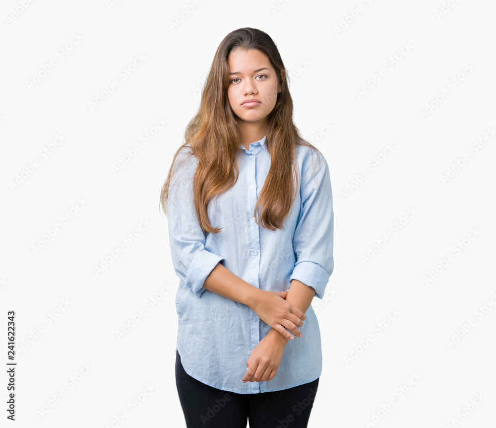 Young beautiful brunette business woman over isolated background Relaxed with serious expression on face. Simple and natural looking at the camera. Young beautiful brunette business woman over isolated background Relaxed with serious expression on face. Simple and natural looking at the camera.