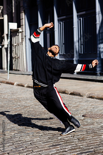 Young man dancing in street