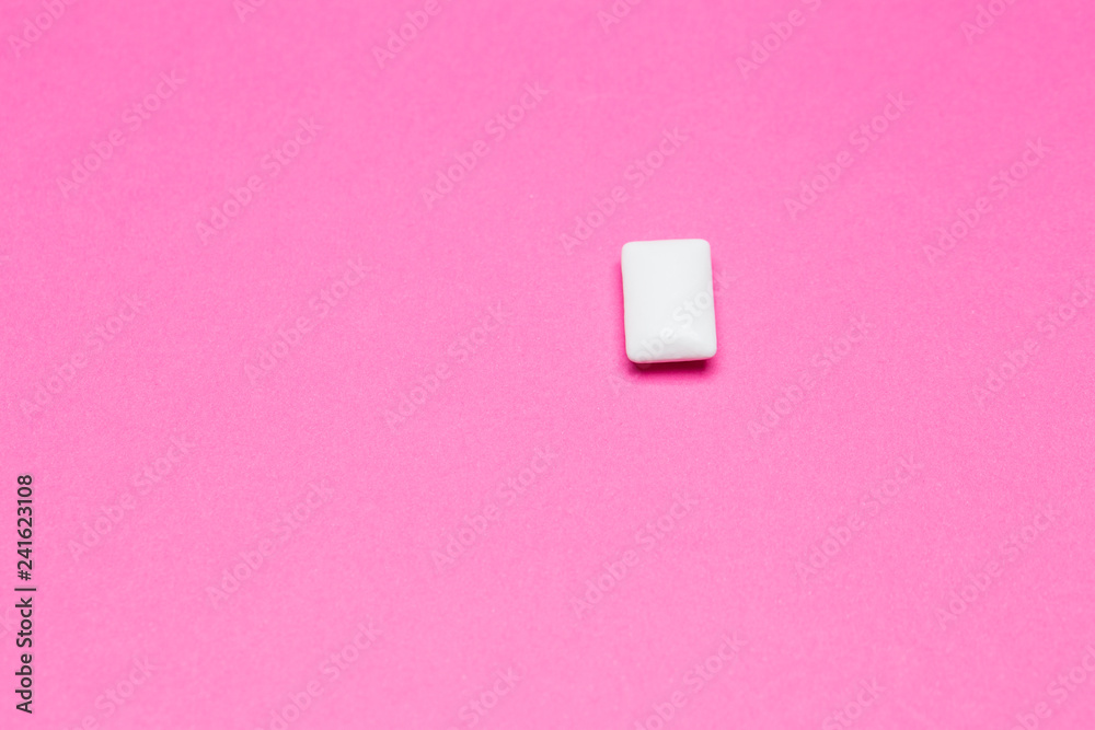 Chewing gum close up on a pink background Chewing gum close up on a pink background