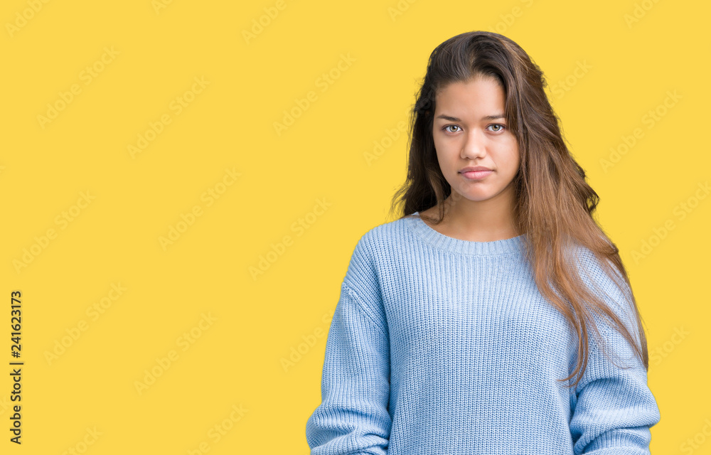 Young beautiful brunette woman wearing blue winter sweater over isolated background skeptic and nervous, frowning upset because of problem. Negative person. Young beautiful brunette woman wearing blue winter sweater over isolated background skeptic and nervous, frowning upset because of problem. Negative person.