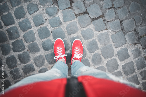 Photography Red shoes on pavement exploring new cities