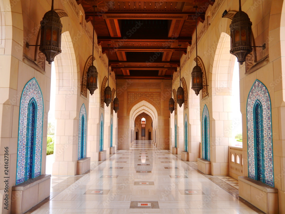 example of islamic architecture with wooden wainscoting and marble floor, mosque in Muscat, Oman, Middle East
