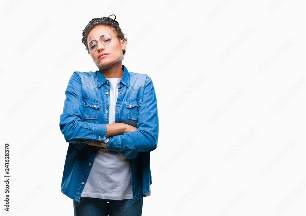 Young braided hair african american girl wearing glasses over isolated background skeptic and nervous, disapproving expression on face with crossed arms. Negative person. Young braided hair african american girl wearing glasses over isolated background skeptic and nervous, disapproving expression on face with crossed arms. Negative person.