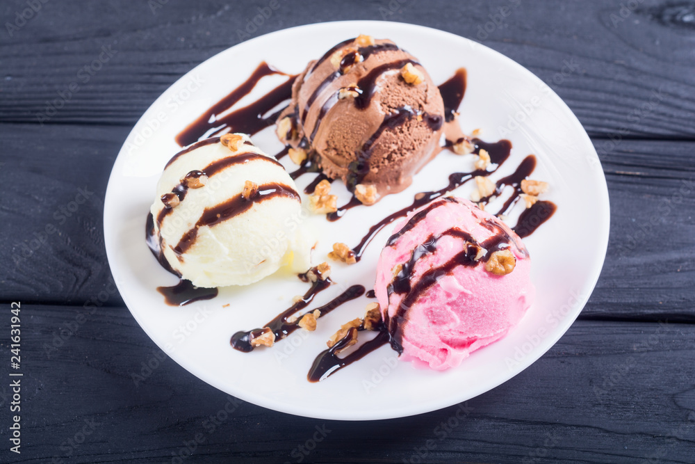 Ice cream with walnuts and chocolate topping Ice cream with walnuts and chocolate topping