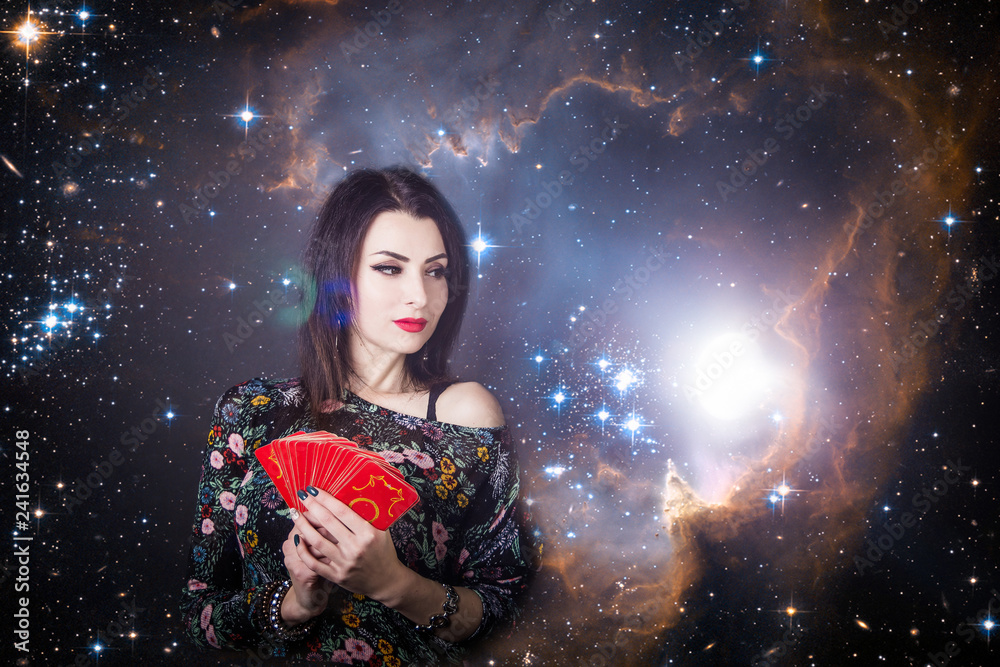 beautiful fortune teller wondering on the Tarot cards. Predicting the future, access to the astral beautiful fortune teller wondering on the Tarot cards. Predicting the future, access to the astral