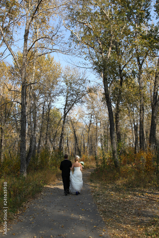 Fototapeta premium young married couple in autumn park