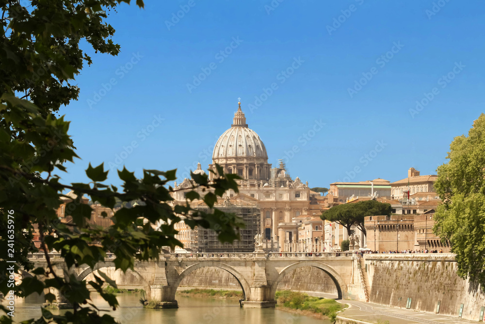 The SaintAngel bridge and St. Peter's Basilica , Rome, Italy .