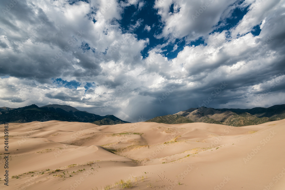 View of desert against cloudy sky at Great Sand Dunes National Park and Preserve View of desert against cloudy sky at Great Sand Dunes National Park and Preserve