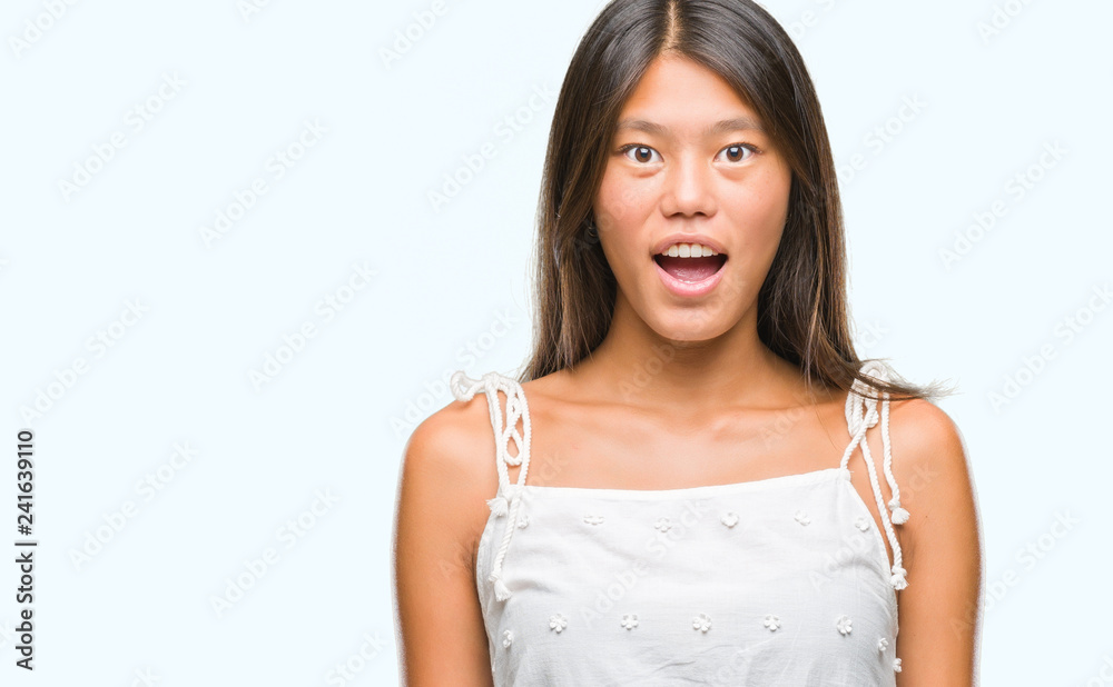 Young asian woman over isolated background afraid and shocked with surprise expression, fear and excited face. Young asian woman over isolated background afraid and shocked with surprise expression, fear and excited face.