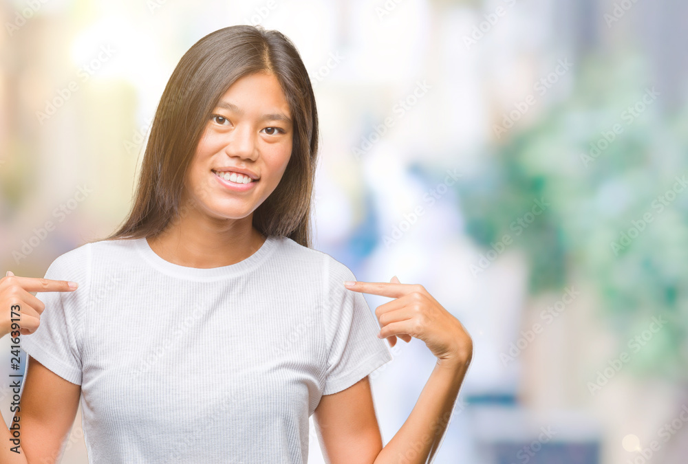 Young asian woman over isolated background looking confident with smile on face, pointing oneself with fingers proud and happy. Young asian woman over isolated background looking confident with smile on face, pointing oneself with fingers proud and happy.