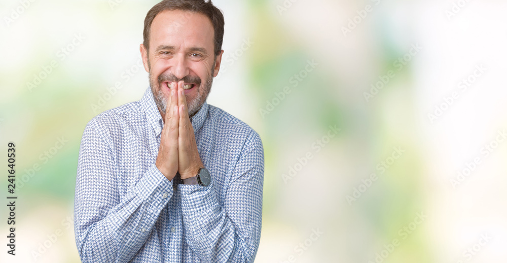 Handsome middle age elegant senior man over isolated background praying with hands together asking for forgiveness smiling confident. Handsome middle age elegant senior man over isolated background praying with hands together asking for forgiveness smiling confident.