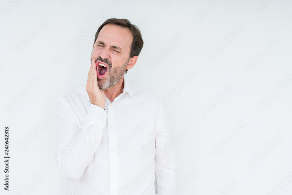 Elegant senior man over isolated background touching mouth with hand with painful expression because of toothache or dental illness on teeth. Dentist concept. Elegant senior man over isolated background touching mouth with hand with painful expression because of toothache or dental illness on teeth. Dentist concept.
