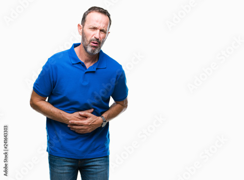 Middle age hoary senior man over isolated background with hand on stomach because nausea, painful disease feeling unwell. Ache concept.