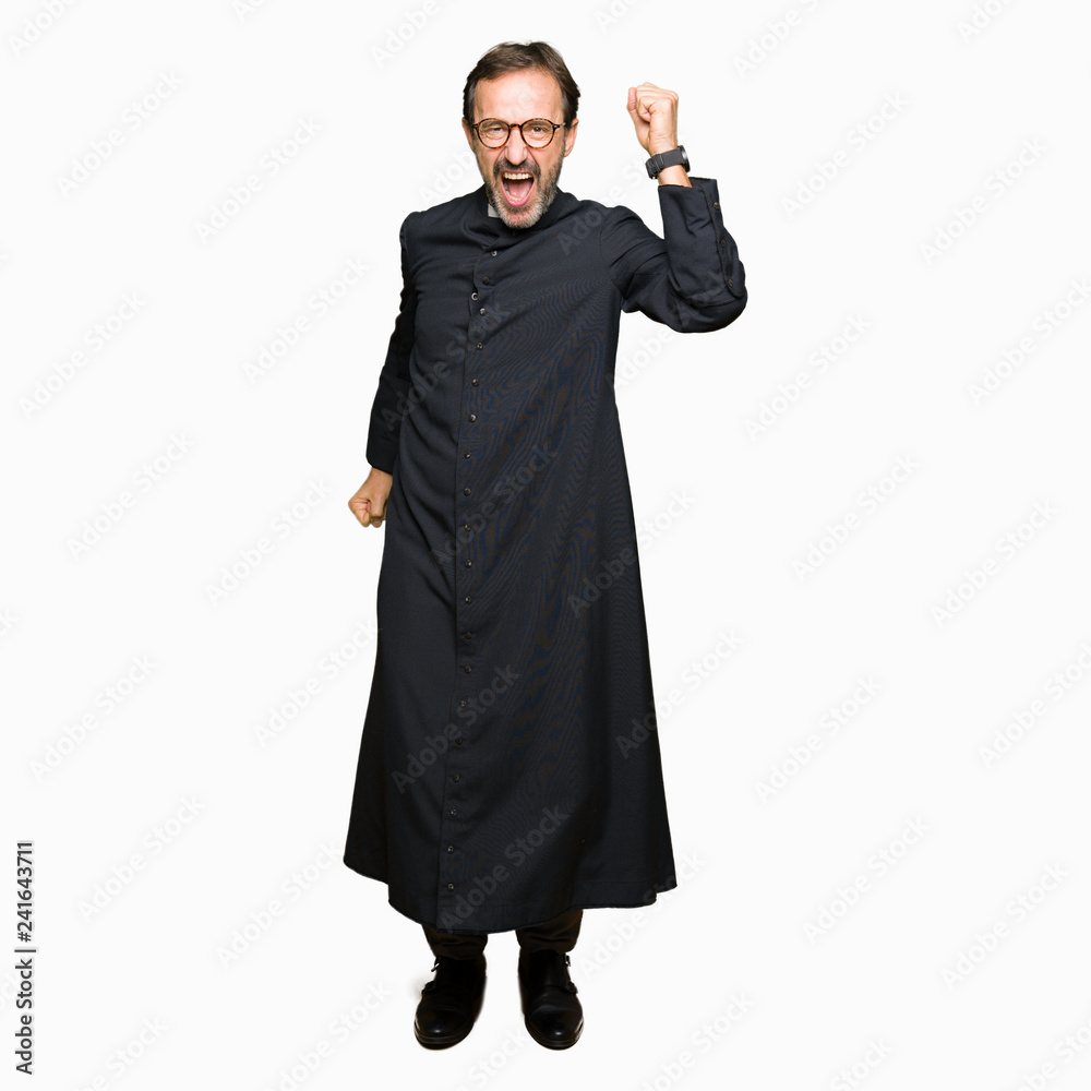 Middle age priest man wearing catholic robe Dancing happy and cheerful, smiling moving casual and confident listening to music Middle age priest man wearing catholic robe Dancing happy and cheerful, smiling moving casual and confident listening to music