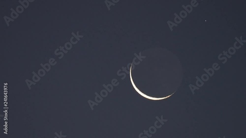 Tokyo,Japan-January 4, 2019: Hard X-ray modulation telescope, HXMT Huiyan, passes near the earthshine moon in Tokyo, Japan, at 6:11AM on Jan 4, 2019

