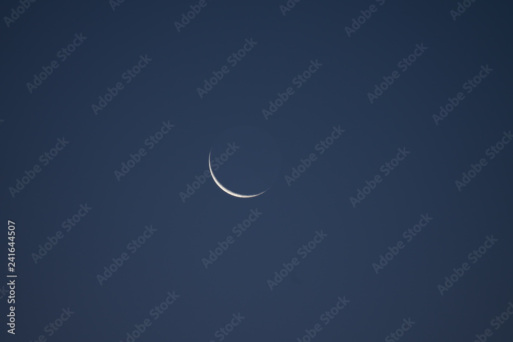 Tokyo,Japan-January 4, 2019: Earthshine observed in Tokyo, Japan, in the morning of Jan 4, 2019 Tokyo,Japan-January 4, 2019: Earthshine observed in Tokyo, Japan, in the morning of Jan 4, 2019