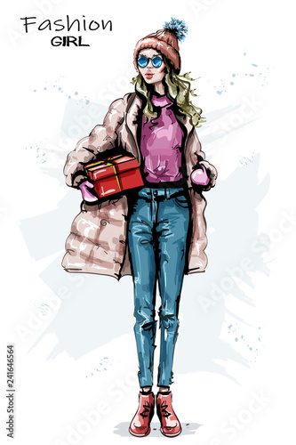 Hand drawn beautiful young woman with gift box. Stylish girl winter outfit. Fashion woman look. Sketch.
