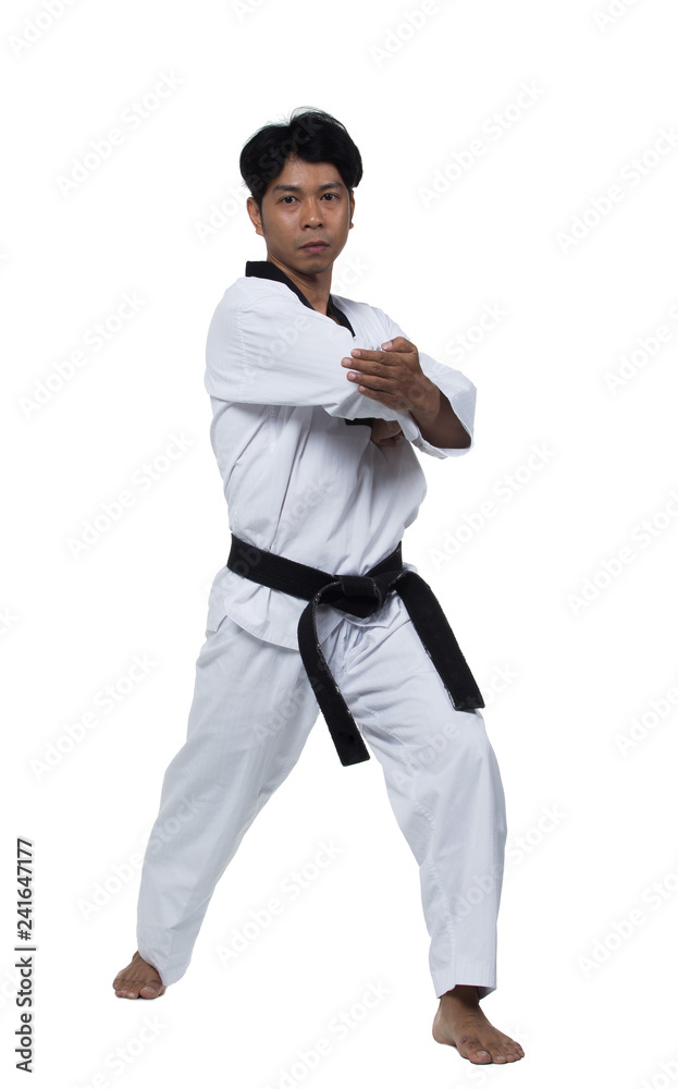 Master Black Belt TaeKwonDo handsome man instructor Teacher fighter show hit pose, studio lighting white background isolated. White formal fighting suit, motion blur hand foots on taekwondo post. Master Black Belt TaeKwonDo handsome man instructor Teacher fighter show hit pose, studio lighting white background isolated. White formal fighting suit, motion blur hand foots on taekwondo post.