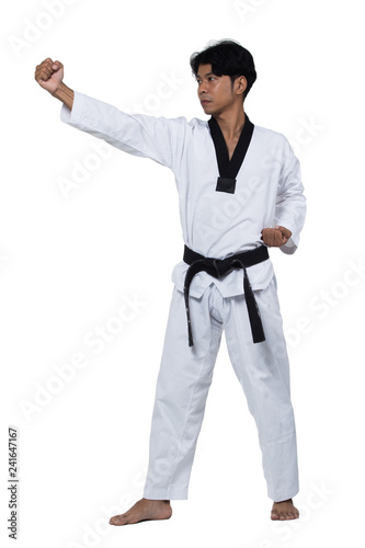 Master Black Belt TaeKwonDo handsome man instructor Teacher fighter show hit pose, studio lighting white background isolated.  White formal fighting suit, motion blur hand foots on taekwondo post. © Jade