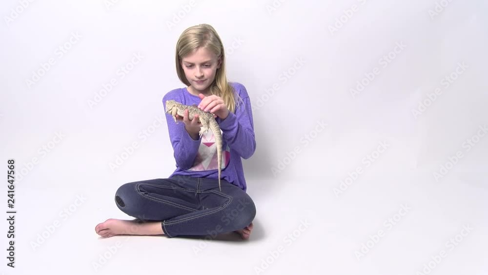 Cute Girl Petting Bearded Dragon Lizard Cute Girl Petting Bearded Dragon Lizard