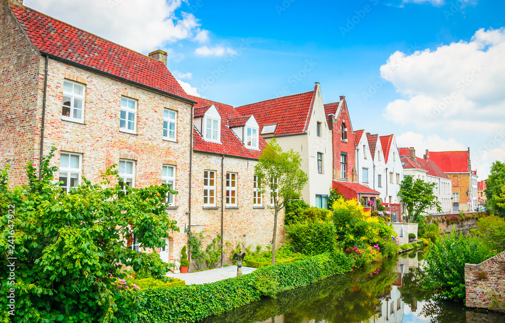 Beautiful canal and traditional houses in the old town of Bruges (Brugge), Belgium Beautiful canal and traditional houses in the old town of Bruges (Brugge), Belgium