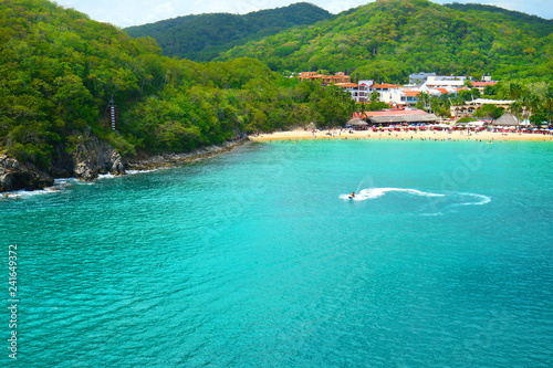 Jet Ski Tourist, Pristine Ocean and Forest. Santa Cruz Bay, Huatulco, Mexico photo